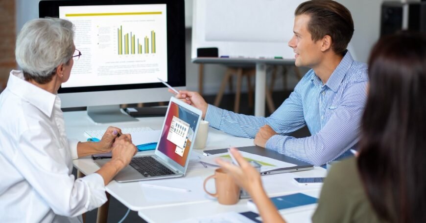 Healthcare market research team analyzing data and charts in a strategy meeting